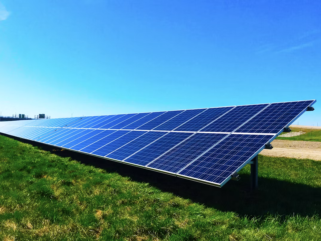 Ground-mounted solar array installed beside agricultural land